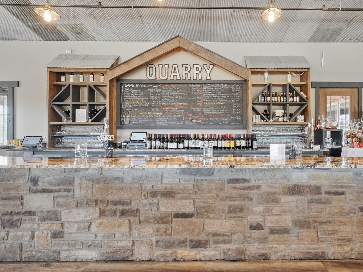 The Quarry indoor bar and wedding reception space with warm lighting