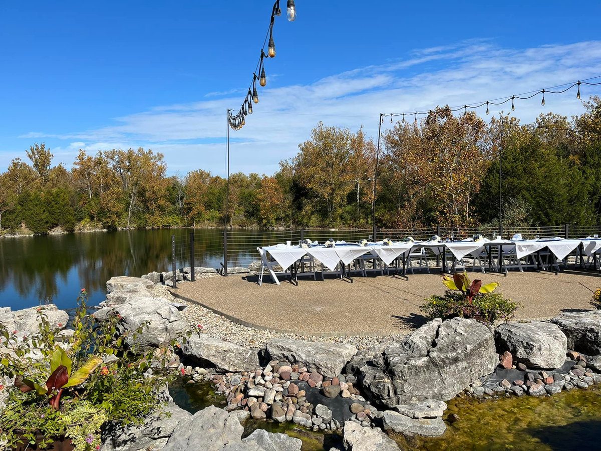 Waterfront patio at The Quarry set up for an outdoor wedding reception