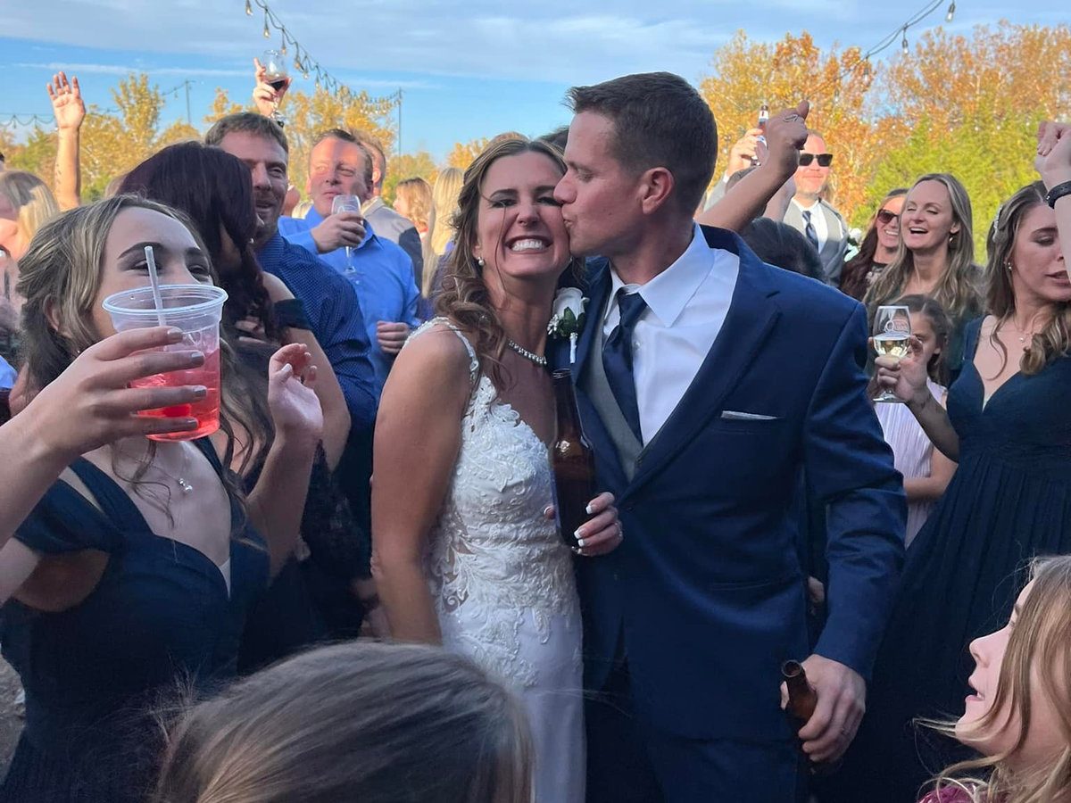 Wedding ceremony at The Quarry with guests seated lakeside