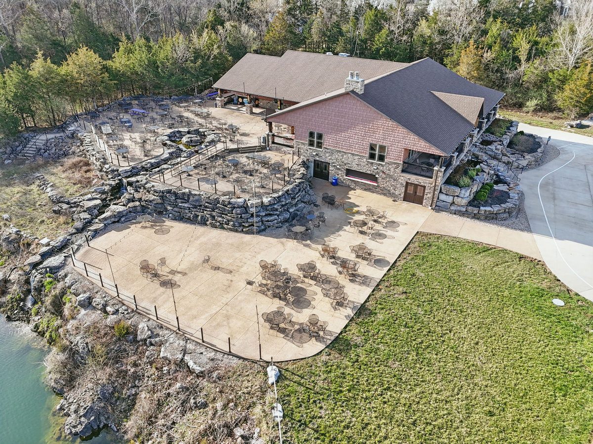 Lakeside wedding ceremony at The Quarry in New Melle, Missouri, near Defiance wine country